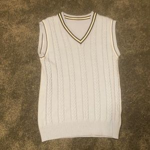 Blue sweater vest, black/white stripes